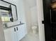 Modern bathroom with white vanity, marble floors, and toilet at 835 Waterton Ave., Myrtle Beach, SC 29579