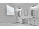 Bathroom features a white double vanity, modern fixtures, and a large window with natural light at 835 Waterton Ave., Myrtle Beach, SC 29579