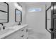Modern bathroom featuring dual sinks, white marble countertop, framed mirrors, and a glass-enclosed shower at 835 Waterton Ave., Myrtle Beach, SC 29579
