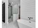 Bathroom showcasing a freestanding tub, glass-enclosed shower, and shiplap wall detail at 835 Waterton Ave., Myrtle Beach, SC 29579