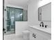 Modern bathroom featuring marble floors, glass-enclosed shower, and white vanity with matte black fixtures at 835 Waterton Ave., Myrtle Beach, SC 29579