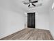 Bright bedroom featuring modern wood flooring, black doors, ceiling fan and ample natural light at 835 Waterton Ave., Myrtle Beach, SC 29579