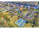 Aerial view showcasing community tennis courts, playground, pool, and clubhouse within lush landscaping at 835 Waterton Ave., Myrtle Beach, SC 29579