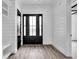 Welcoming entryway featuring plank walls, a sidelight door, and a built-in bench at 835 Waterton Ave., Myrtle Beach, SC 29579