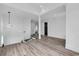 Foyer showing wood floors, a shiplap accent wall, and a modern chandelier at 835 Waterton Ave., Myrtle Beach, SC 29579