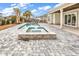 Relaxing outdoor pool and spa area featuring a stone surround and a paved patio area at 835 Waterton Ave., Myrtle Beach, SC 29579