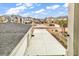 Community view from upper-level deck showcases surrounding homes, landscaping, and neighborhood street at 835 Waterton Ave., Myrtle Beach, SC 29579