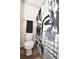 Quaint bathroom featuring a toilet and decorative shower curtain, wood floors at 9550 Dunes Gable Dr. # F, Myrtle Beach, SC 29572