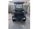 View of a black golf cart with custom black wheels and tires parked on concrete at 9550 Dunes Gable Dr. # F, Myrtle Beach, SC 29572