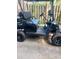Golf cart featuring custom paint job, custom wheels and a windshield for added comfort and safety at 9550 Dunes Gable Dr. # F, Myrtle Beach, SC 29572