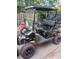 Golf cart featuring custom paint job, custom wheels and a windshield for added comfort and safety at 9550 Dunes Gable Dr. # F, Myrtle Beach, SC 29572