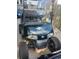 Golf cart featuring custom paint job, custom wheels and a windshield for added comfort and safety at 9550 Dunes Gable Dr. # F, Myrtle Beach, SC 29572