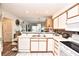 Open kitchen featuring white cabinetry, stainless steel sink, and bright lighting at 9550 Dunes Gable Dr. # F, Myrtle Beach, SC 29572