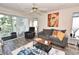 Relaxing living room features a comfortable sofa, coffee table, and access to outdoor balcony at 9550 Dunes Gable Dr. # F, Myrtle Beach, SC 29572