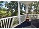 Enjoy the scenery on this screened porch with white railings and blue carpet at 9550 Dunes Gable Dr. # F, Myrtle Beach, SC 29572