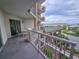 View from the balcony with a table and chairs overlooking the entrance at 9994 Beach Club Dr. # 205, Myrtle Beach, SC 29572