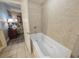 A close up of the jacuzzi tub with tiled backsplash at 9994 Beach Club Dr. # 205, Myrtle Beach, SC 29572