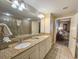 A well-appointed bathroom with double sinks, granite countertops, and a walk-in shower at 9994 Beach Club Dr. # 205, Myrtle Beach, SC 29572