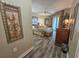 A well-decorated bedroom with a king-size bed, dresser, and access to a balcony at 9994 Beach Club Dr. # 205, Myrtle Beach, SC 29572