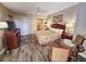 Comfortable bedroom with a queen bed, stylish furnishings, and a well-lit ambiance at 9994 Beach Club Dr. # 205, Myrtle Beach, SC 29572