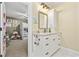 Clean bathroom with white vanity, quartz countertop, and a view into a bedroom at 11 Valencia Circle, Myrtle Beach, SC 29572