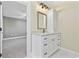 Modern bathroom with white vanity, granite countertop, and a large mirror at 11 Valencia Circle, Myrtle Beach, SC 29572