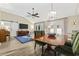 Bright dining area with wooden table and view to living room at 11 Valencia Circle, Myrtle Beach, SC 29572