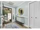 Light and airy entryway with a console table and mirror at 11 Valencia Circle, Myrtle Beach, SC 29572