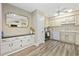 White kitchen cabinets and a large island at 11 Valencia Circle, Myrtle Beach, SC 29572