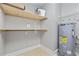 Laundry room with shelves and water heater at 11 Valencia Circle, Myrtle Beach, SC 29572