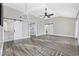 Bright living room with hardwood floors, high ceilings, and sliding barn doors at 11 Valencia Circle, Myrtle Beach, SC 29572