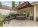 Brick patio with hot tub and retractable awning at 11 Valencia Circle, Myrtle Beach, SC 29572