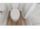 Simple toilet and wood floor in a small bathroom at 241 Bent Green Ct. # 64A, Murrells Inlet, SC 29576