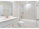 Bathroom with white vanity, large mirror, and gray tiled shower/tub combo at 241 Bent Green Ct. # 64A, Murrells Inlet, SC 29576