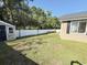 View of the backyard and the storage shed, with a white fence at 2549 Sugar Creek Ct., Myrtle Beach, SC 29579