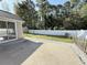 View of the backyard, with a white fence, shed, and a concrete patio at 2549 Sugar Creek Ct., Myrtle Beach, SC 29579