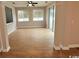 Bright sunroom with sliding glass doors, three windows, and wood-look flooring at 2549 Sugar Creek Ct., Myrtle Beach, SC 29579