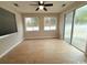 Bright sunroom with wood-look floors, ceiling fan and sliding glass doors to the backyard at 2549 Sugar Creek Ct., Myrtle Beach, SC 29579