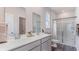 Modern bathroom featuring a double vanity, a glass-enclosed shower, and stylish fixtures at 318 Cheerful Way, Little River, SC 29566