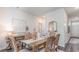 Elegant dining room with a rustic wooden table and seating for six at 318 Cheerful Way, Little River, SC 29566