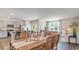 Open-concept dining area connected to the kitchen and living room, perfect for entertaining at 318 Cheerful Way, Little River, SC 29566