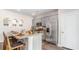 Contemporary kitchen with gray cabinets, stainless steel appliances, and a functional island with breakfast bar at 318 Cheerful Way, Little River, SC 29566