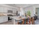 Modern kitchen featuring gray cabinets, stainless steel appliances, and a granite-topped island with seating at 318 Cheerful Way, Little River, SC 29566