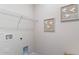 Functional laundry room with shelving and connections for washer and dryer at 318 Cheerful Way, Little River, SC 29566