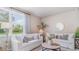 Inviting living room showcasing white sofas, patterned rug, and a large window with natural light at 318 Cheerful Way, Little River, SC 29566