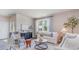 Bright living room featuring stylish furnishings, patterned wallpaper, and a large window at 318 Cheerful Way, Little River, SC 29566