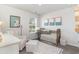 Charming Bedroom with crib, armchair, and plenty of natural light at 3851 Lady Bug Dr., Shallotte, NC 28470