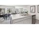 Kitchen island with sink, stainless steel dishwasher, and view into dining area at 3851 Lady Bug Dr., Shallotte, NC 28470