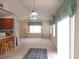 Dining area with stained glass light fixture and access to patio at 466 Spauldingwood Rd., Little River, SC 29566