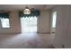 Bright dining room with sliding glass doors to patio at 466 Spauldingwood Rd., Little River, SC 29566